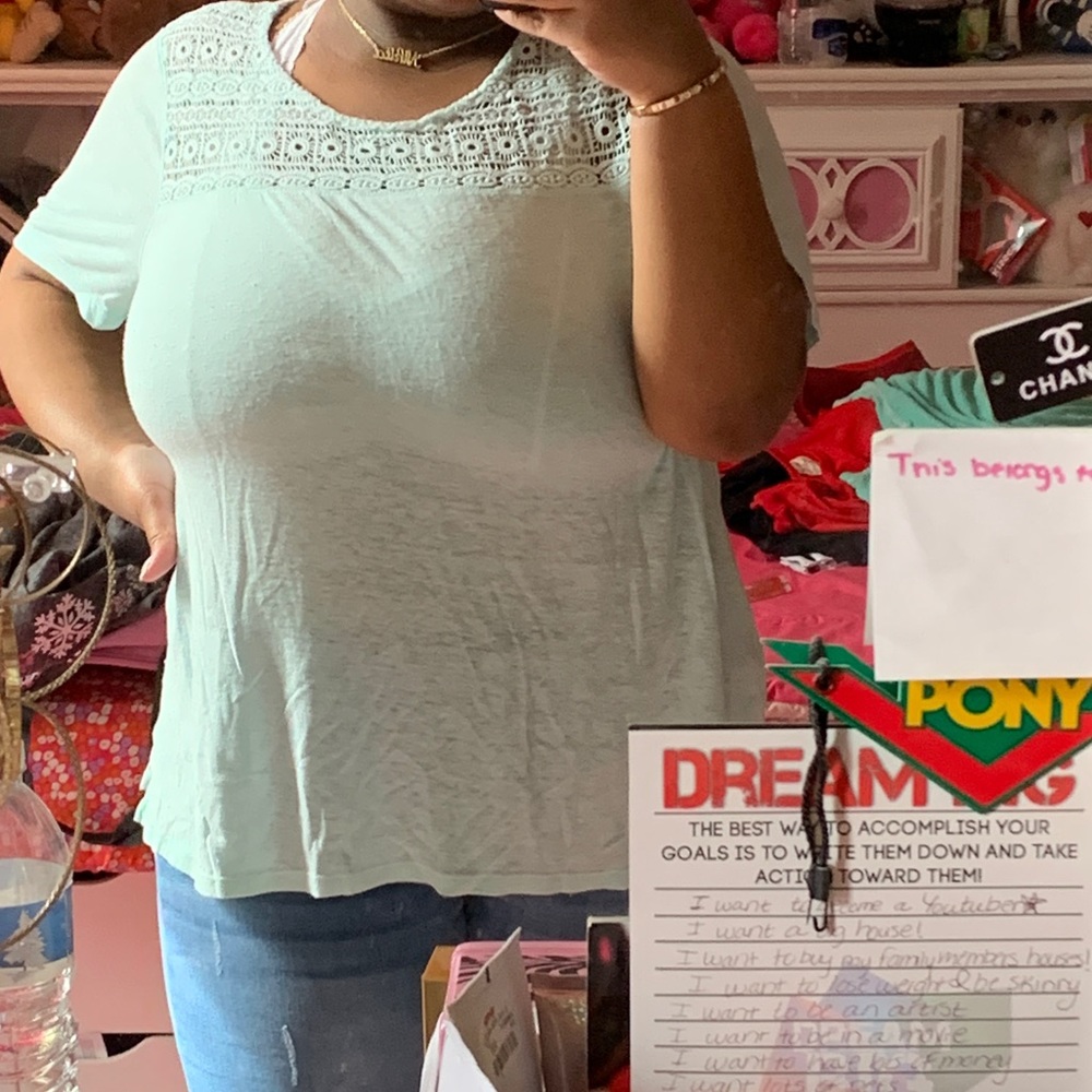 A sheer turquoise top
